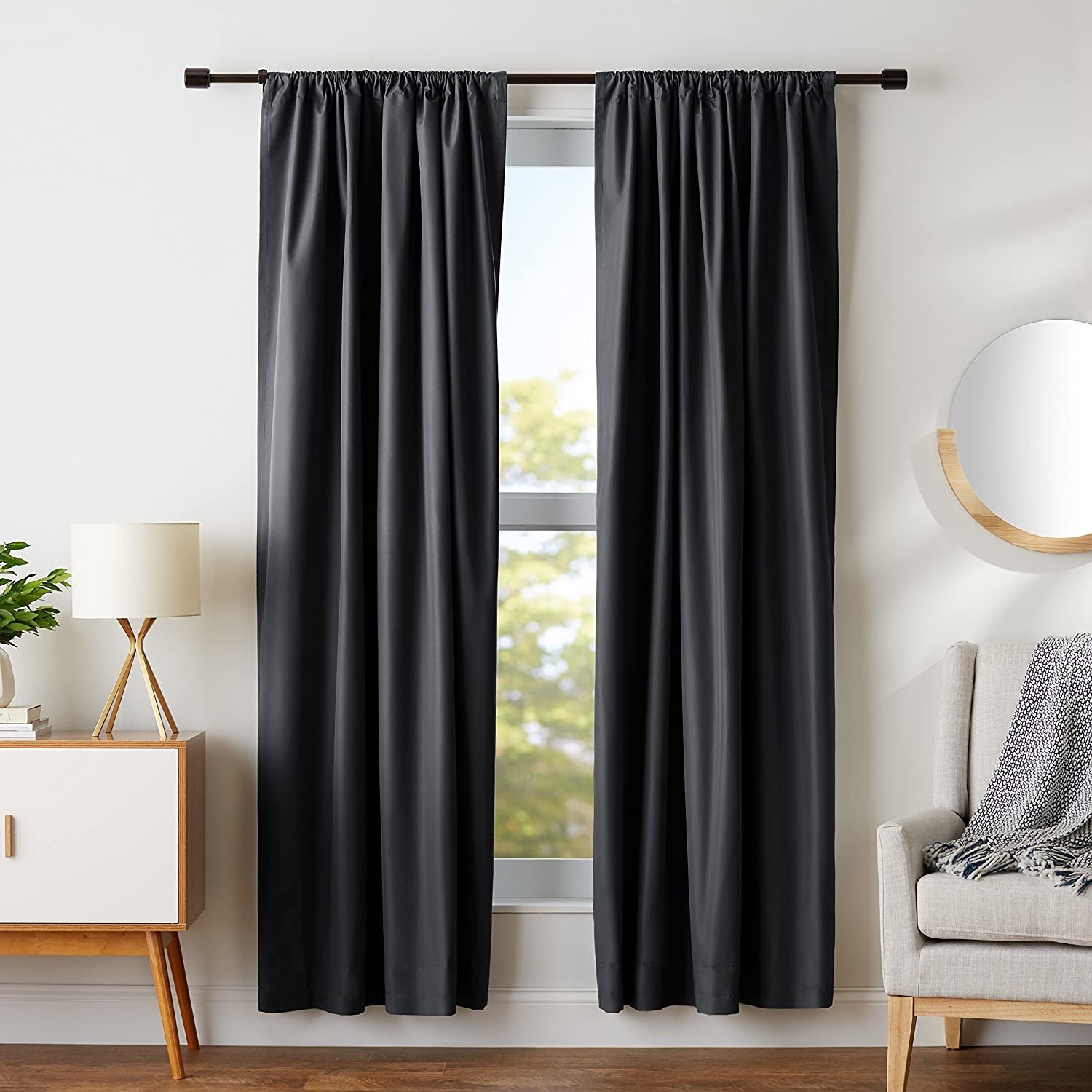 black blackout curtains hanging up on a window