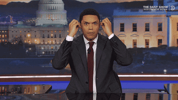 Trevor Noah making a mind-blown gesture in the Daily Show