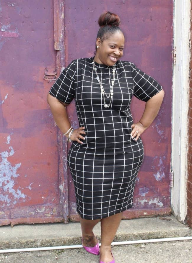 Reviewer photo of a person wearing a black geometric patterned dress