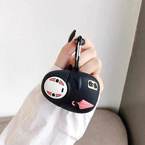 A person holding the airpods case shaped like No-Face from Studio Ghibli&#x27;s Spirited Away 