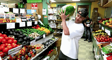 Guy slams a whole watermelon on the grocery store floor