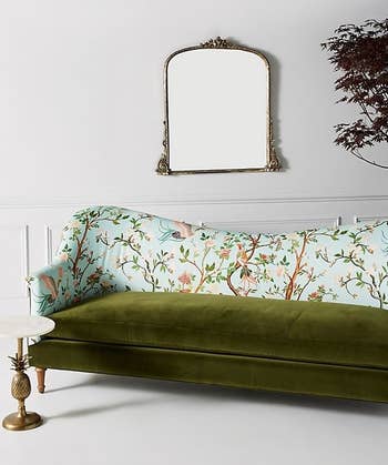 the front of the green velvet and floral sofa