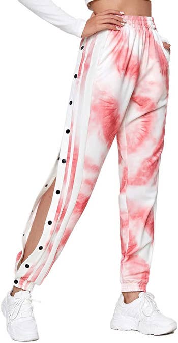 model in white and pink tie-dye snap pants