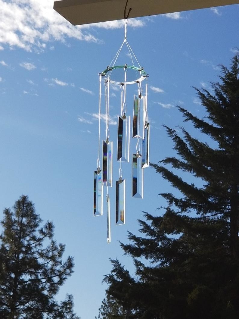 glass wind chime hanging from a tree