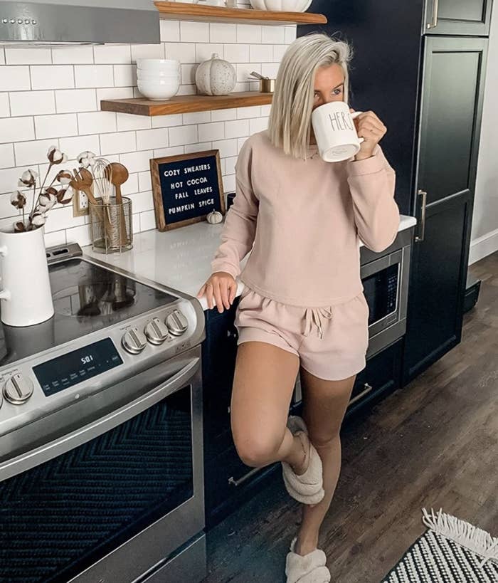 A person wearing a mauve loungewear shorts set