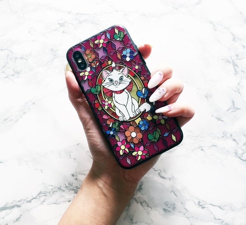 A vibrant phone case displaying Marie from Aristocats