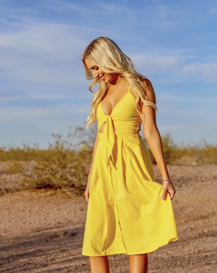 Reviewer wearing a yellow dress