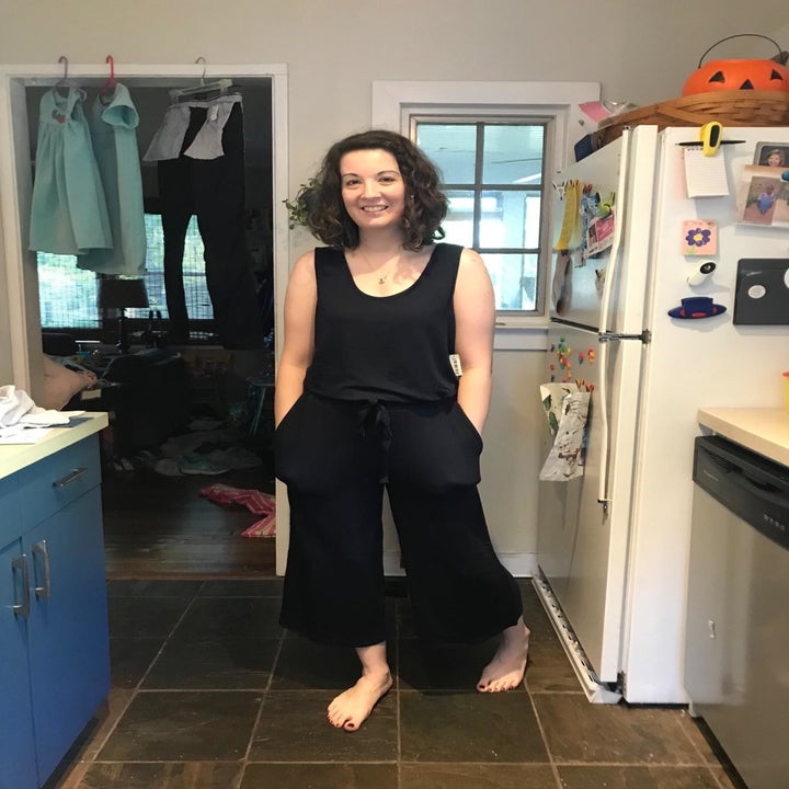 a reviewer wearing the jumpsuit in black