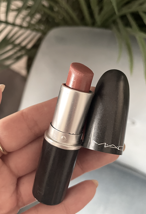 May holding the lipstick