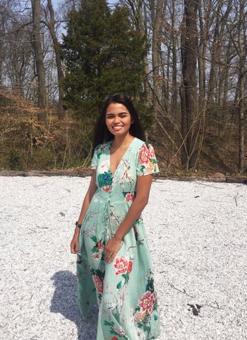 reviewer wearing the mint green dress