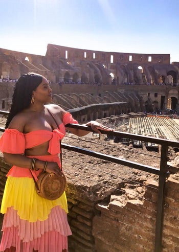 reviewer wearing a dress with the bag