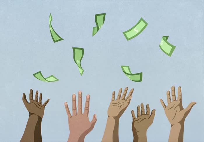 hands reaching for money falling from sky