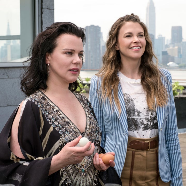 Maggie and Liza standing on a rooftop 