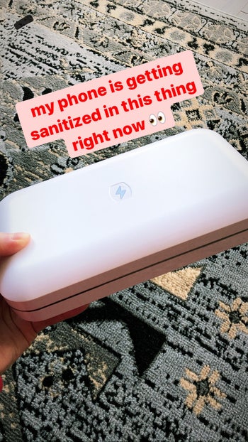 The writer holding the sanitizer with the caption 