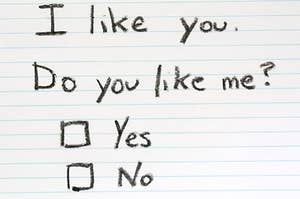 A handwritten note that says, "I like you. Do you like me?" with two square boxes next to the words "yes" and "no"