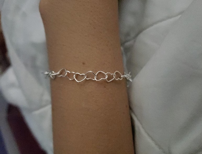 A reviewer wearing the bracelet 