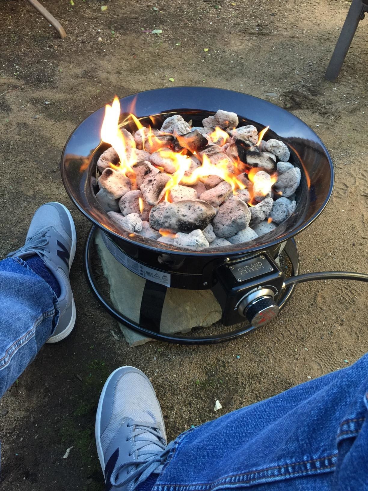A reviewer uses the product for a campfire