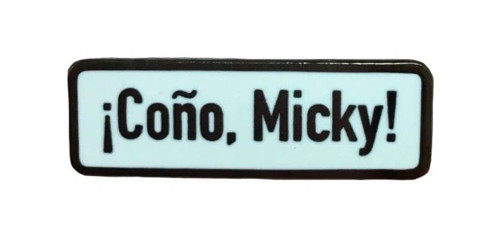 The pin that reads, &quot;Coño, Mickey!&quot;
