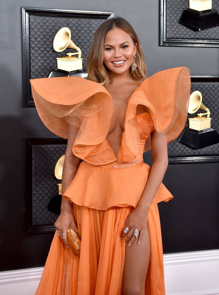 Chrissy posing on the Grammys red carpet