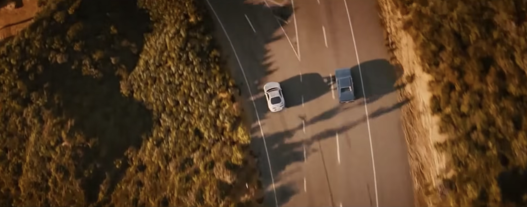 Cars splitting at a fork in the road