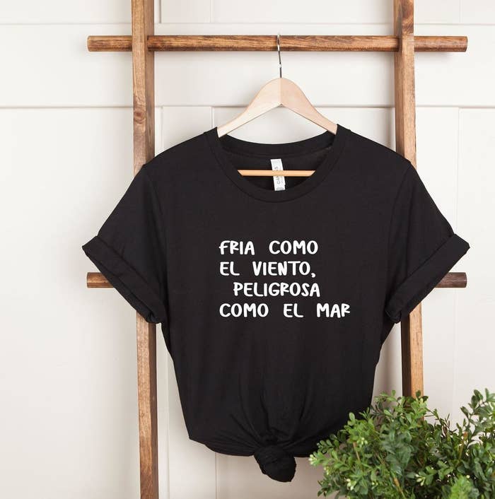 The T-shirt that reads, &quot;Fria como el viento, peligrosa como el mar&quot;