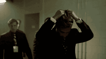 A gif of Diego Boneta as Luis Miguel playing with his hair in Luis Miguel: La Serie