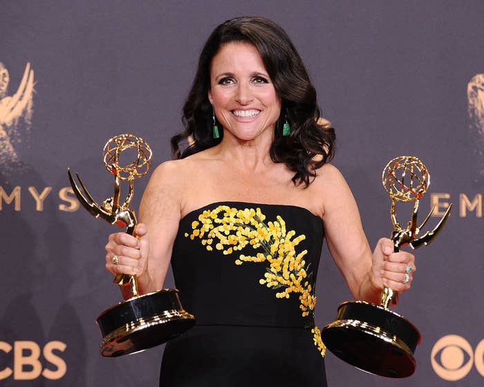 Julia holding two Emmy awards
