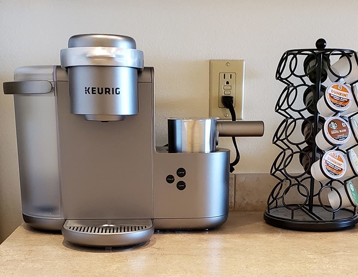 reviewer photo of the Keurig machine on their countertop next to K-cup carousel