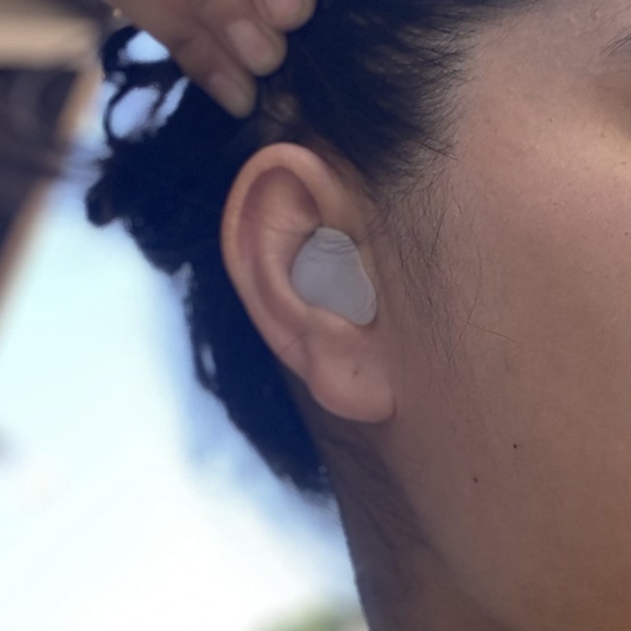 A person wearing ear plugs