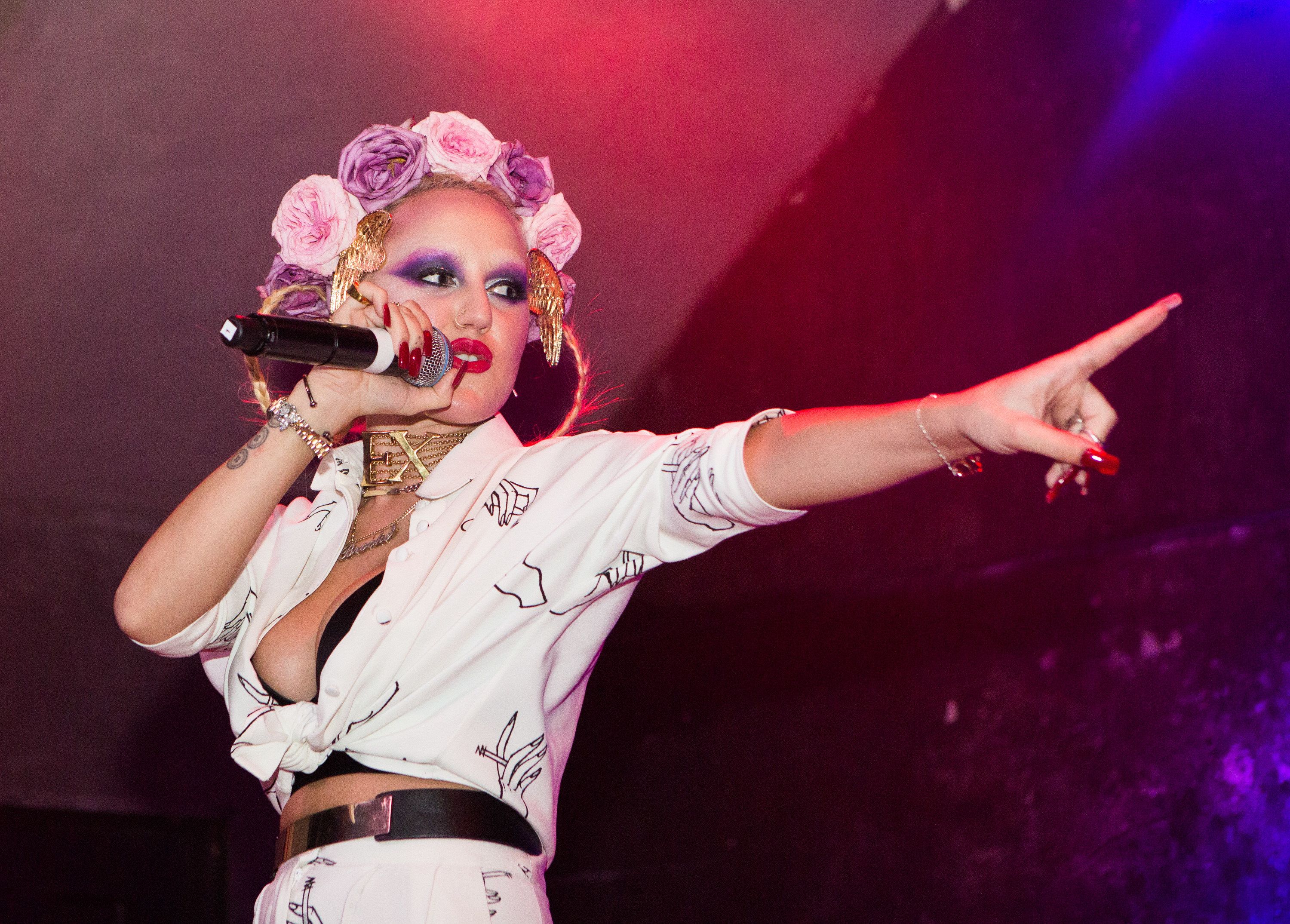 Brooke performing on stage with a flower crown