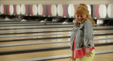 woman dancing in bowling alley