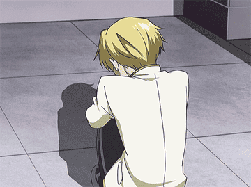 Tamaki looks up from hugging his knees with tears in his eyes