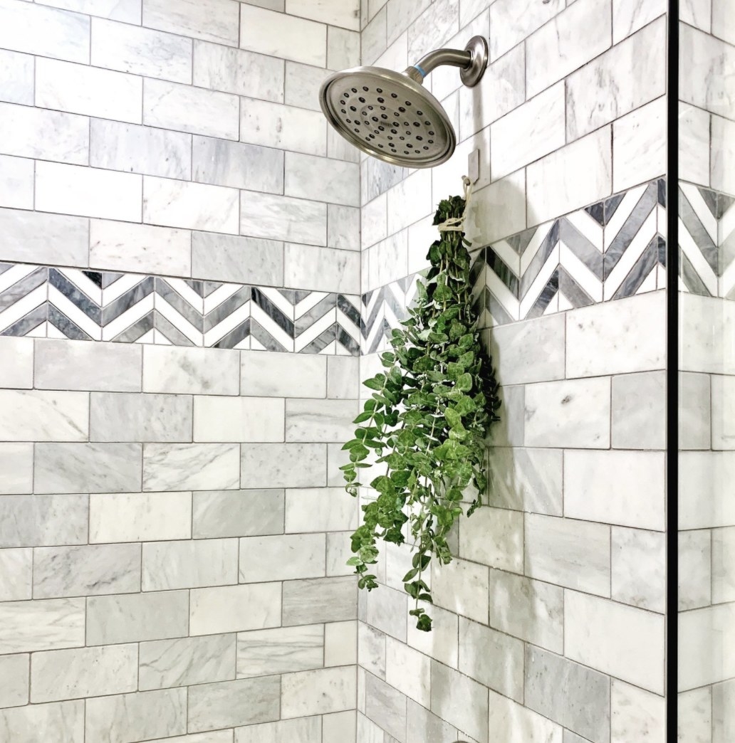 A eucalyptus bunch under a shower head