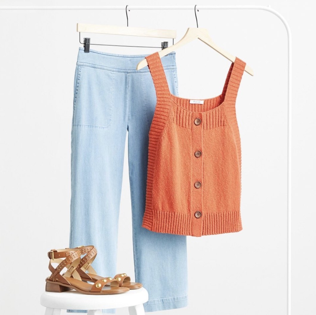 A top, pants, and sandals