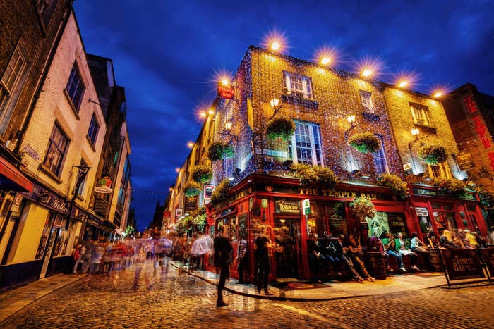 People outside a Dublin pub at night