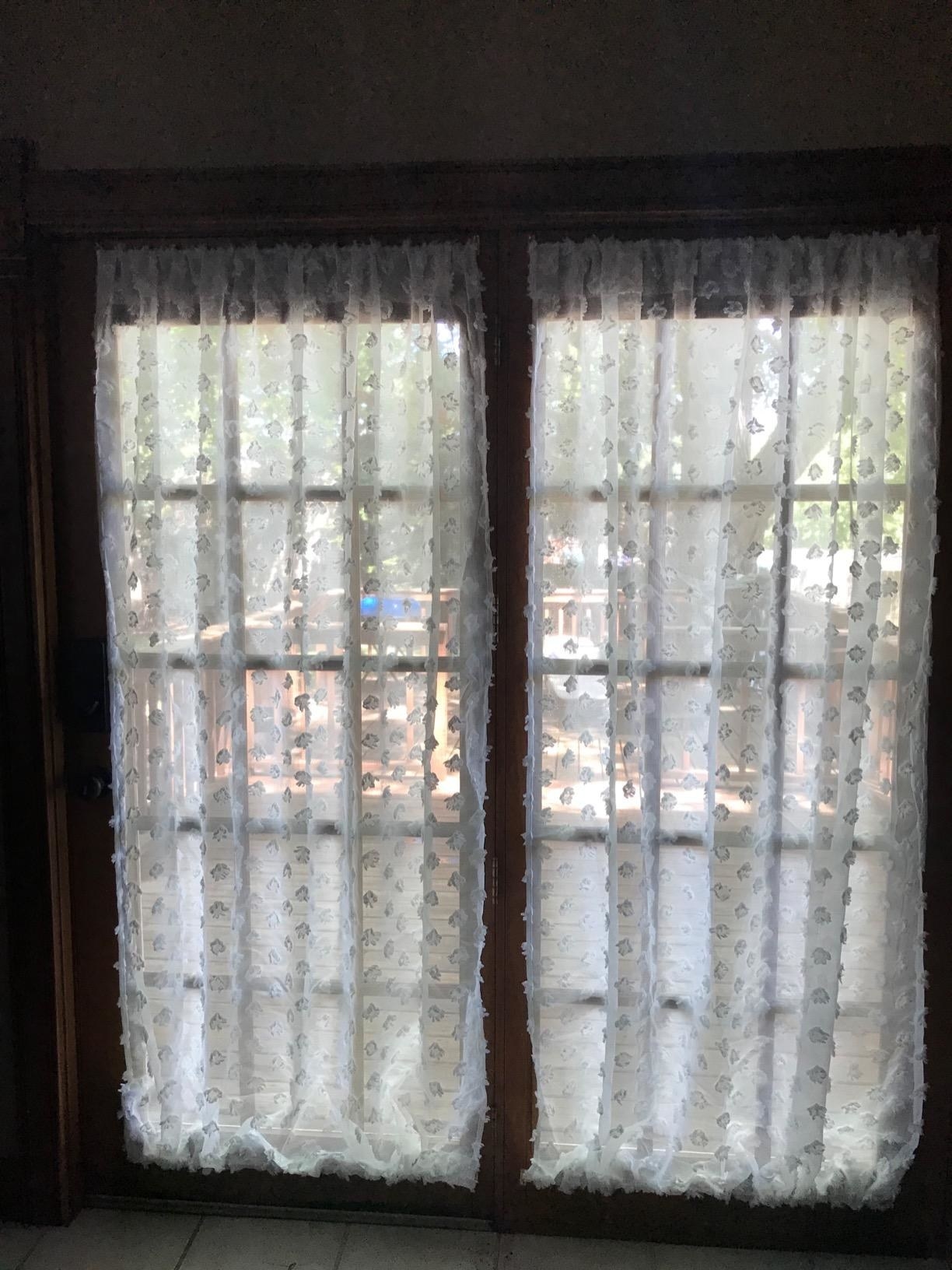 sheer white curtains on french windows