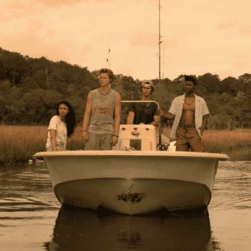 Four teens on a boat