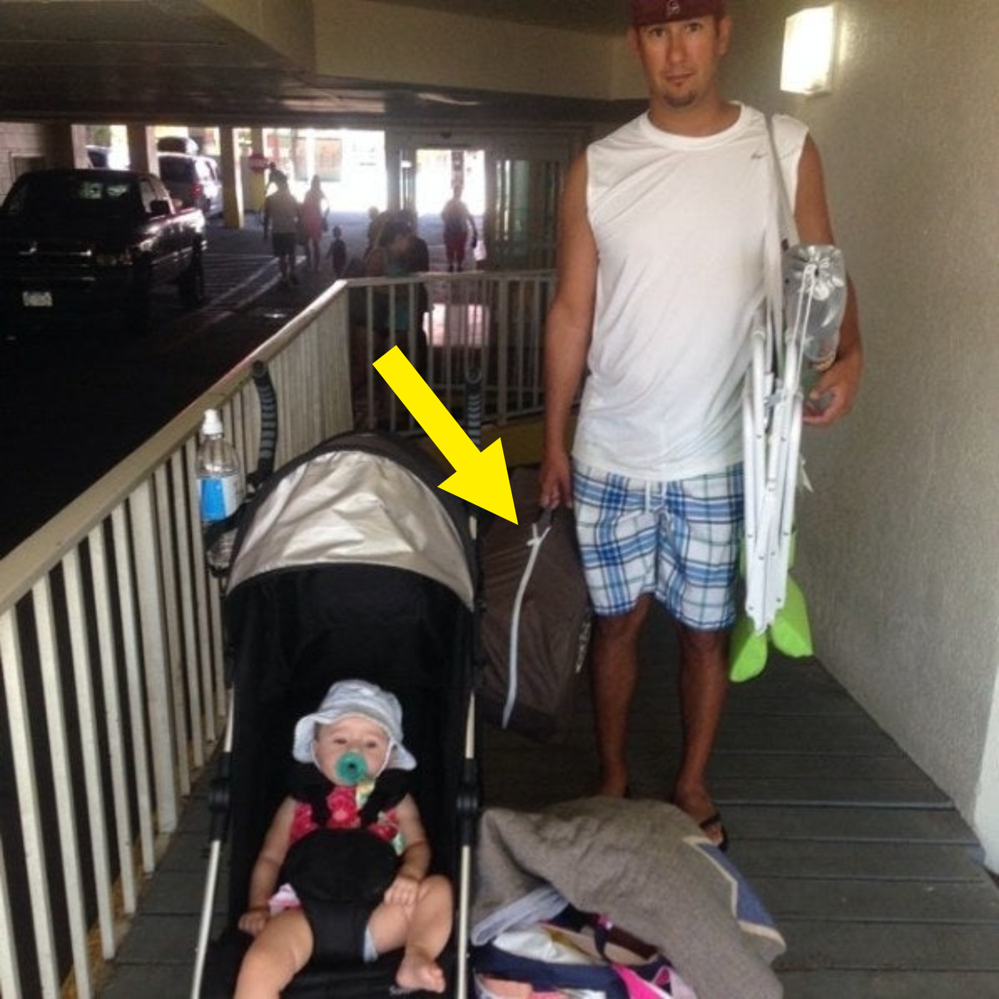 The author&#x27;s husband carrying a Pack &#x27;n&#x27; Play to the beach for the baby to nap