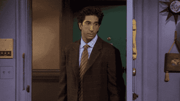 Ross from Friends making a rude gesture and slamming the door