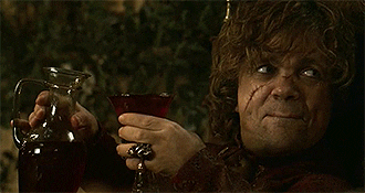 Peter Dinklage as Tyrion Lannister pouring a drink