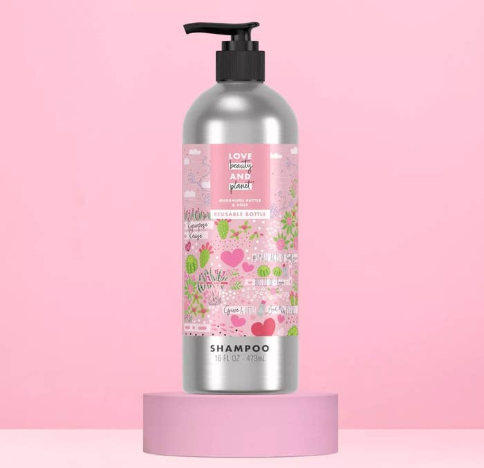 Bottle of shampoo against pink background