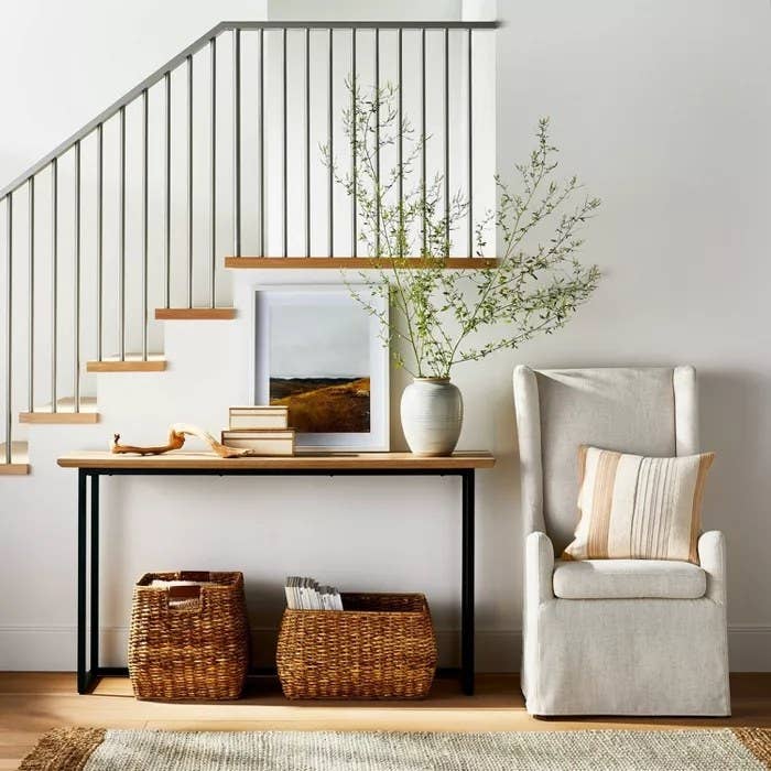 The console with a metal frame with a wooden countertop