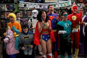 Cast of the big bang theory dressed like the justice league