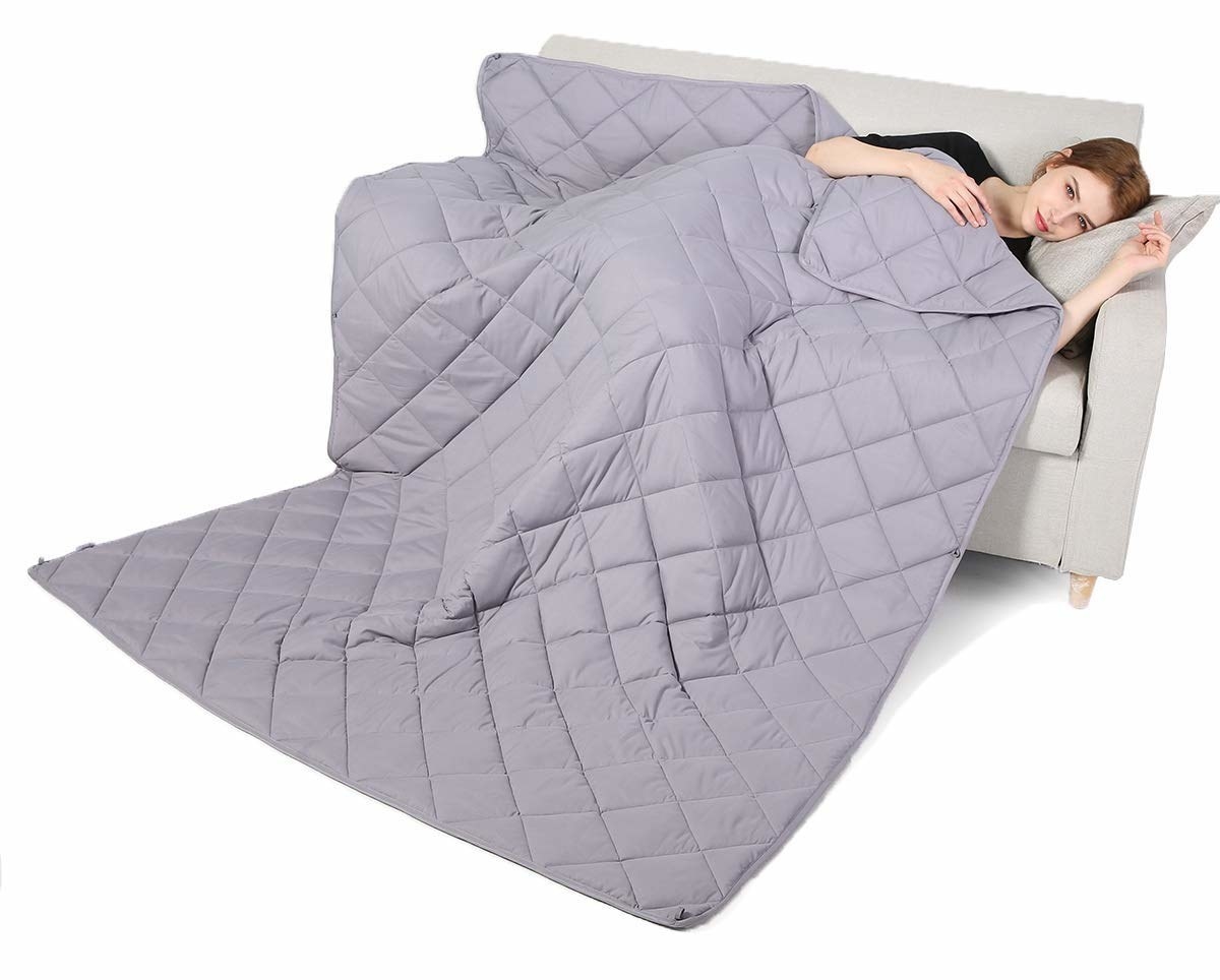 A woman using the weighted blanket.