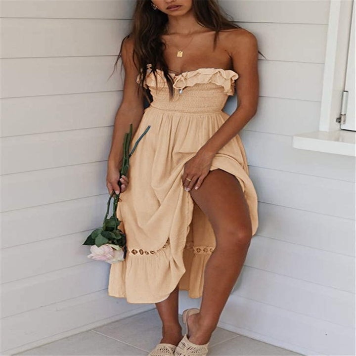 A model wearing the dress in Apricot