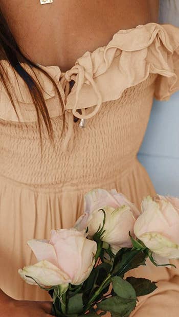A close up of the ruffled and smocked bodice