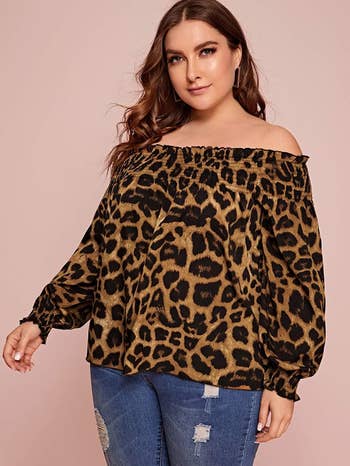another model wearing the leopard print top
