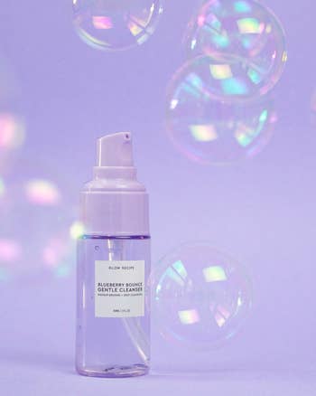 the small purple bottle of cleanser