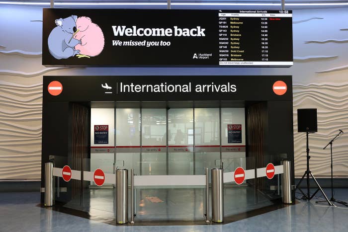 A sign over the International arrivals that says &quot;Welcome back, we missed you too&quot;