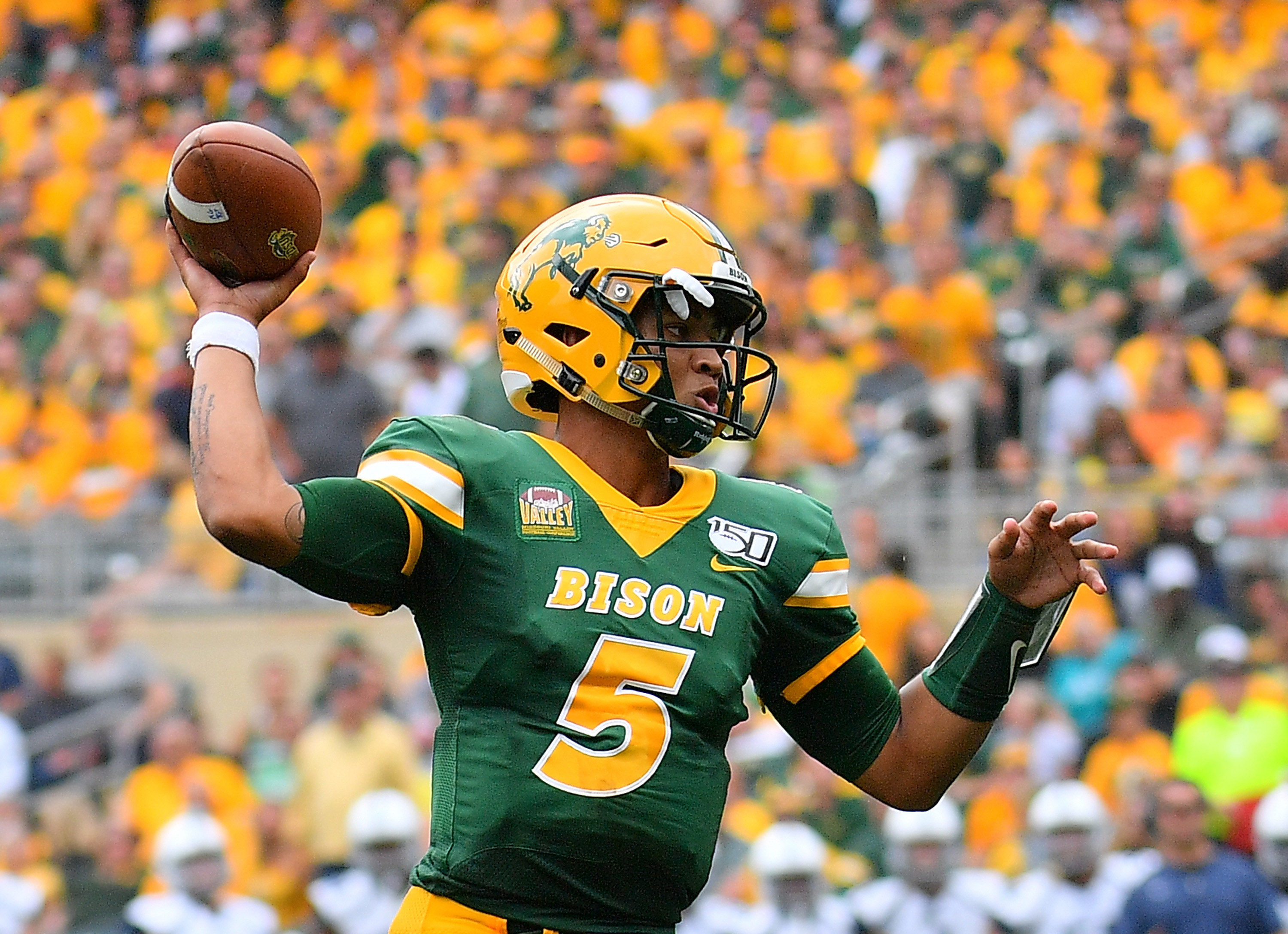 Trey Lance throwing football